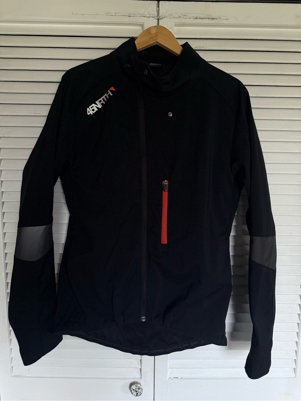 45NRTH Black Softshell Cycling Jacket with Red Zipper Accent